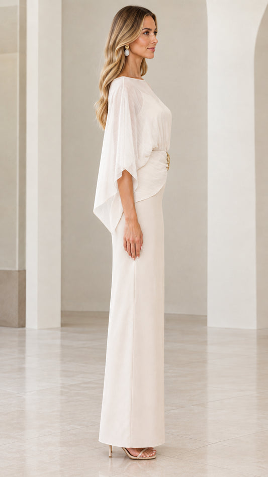 Side profile view of ivory cape overlay formal column gown