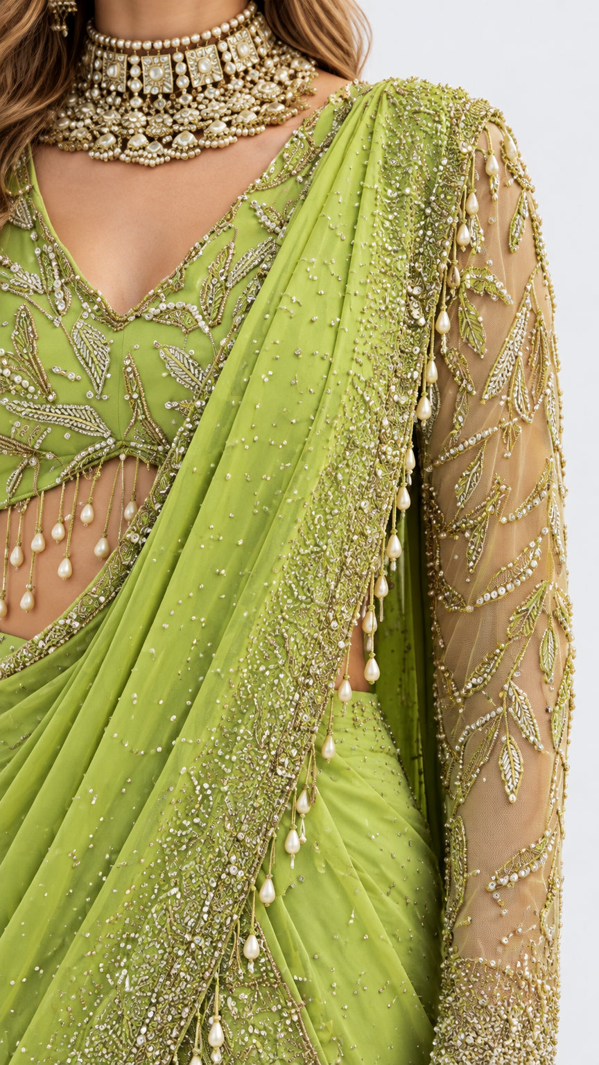Close-up detail of beaded V-neckline, hanging bead fringe, and embroidered drape in lime green