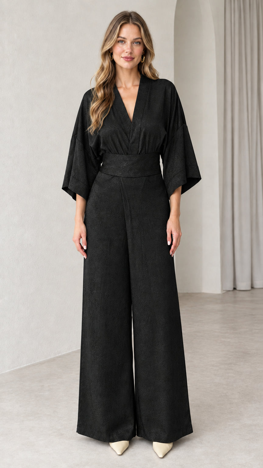 Front view of model wearing Black kimono sleeve wide leg jumpsuit