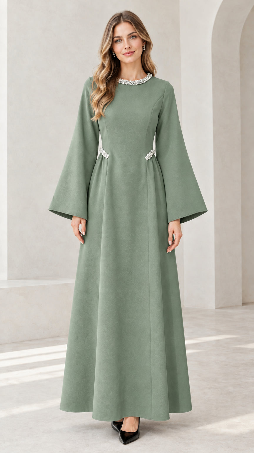 Front view of model wearing sage green embellished flare sleeve maxi dress