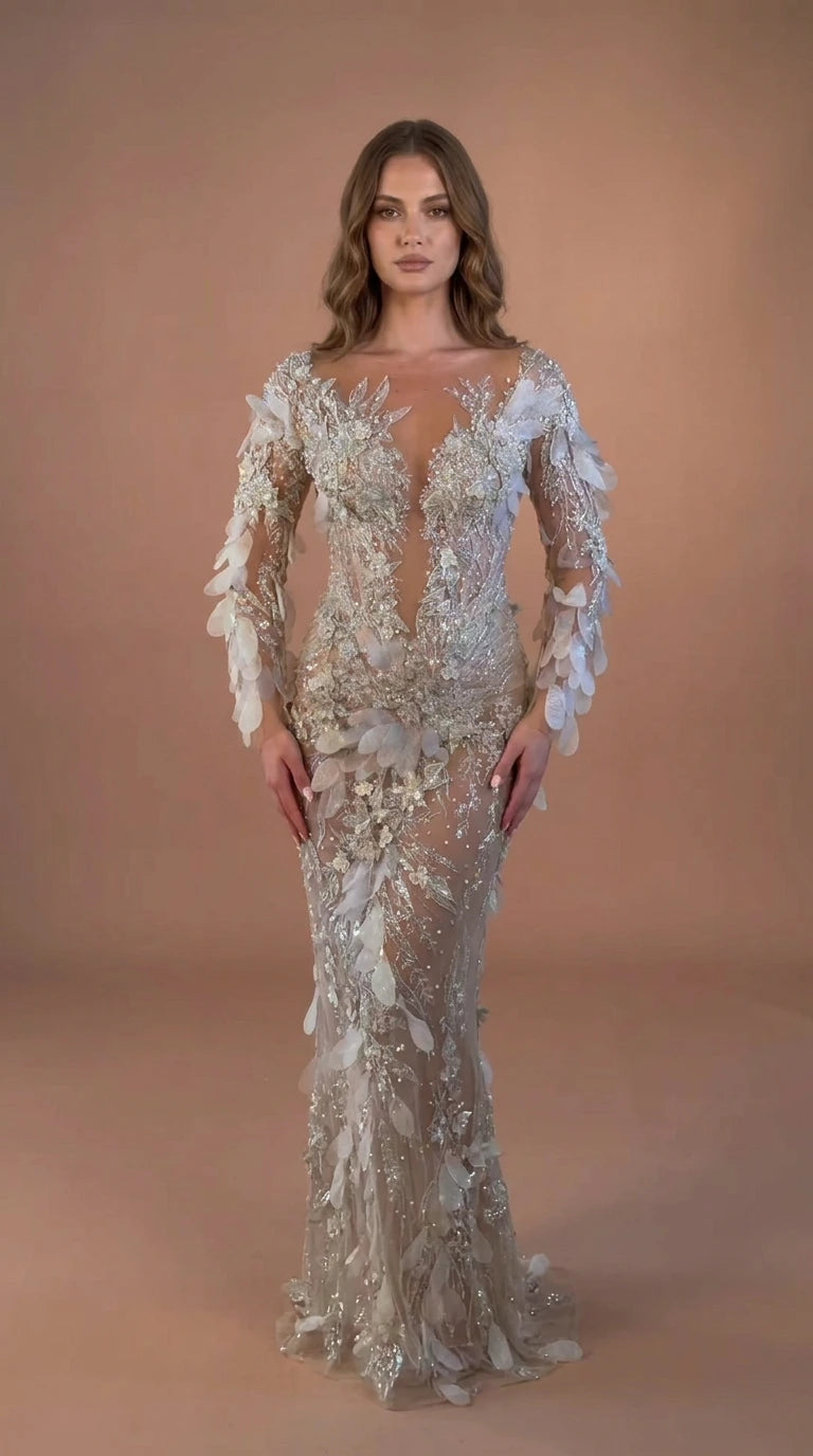 Front view of model wearing Champagne Silver illusion beaded 3D petal mermaid evening gown