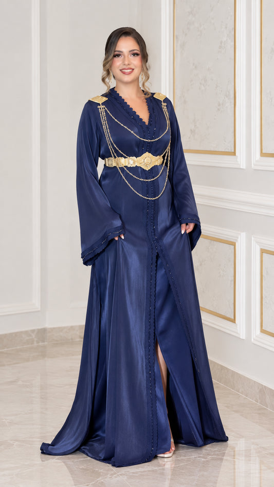 Full front view of navy blue satin kaftan maxi dress with gold shoulder chains and belt