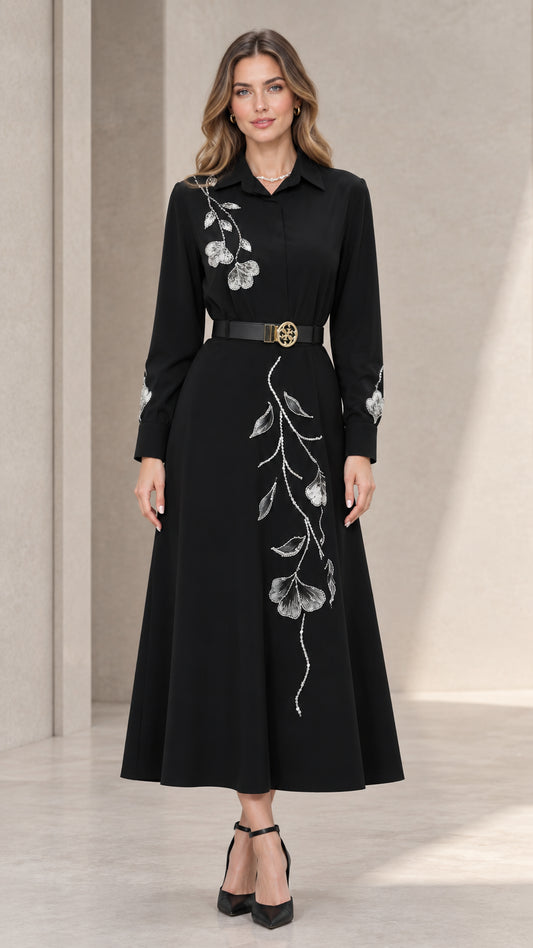 Front full view of black embroidered long sleeve midi shirt dress with waist belt