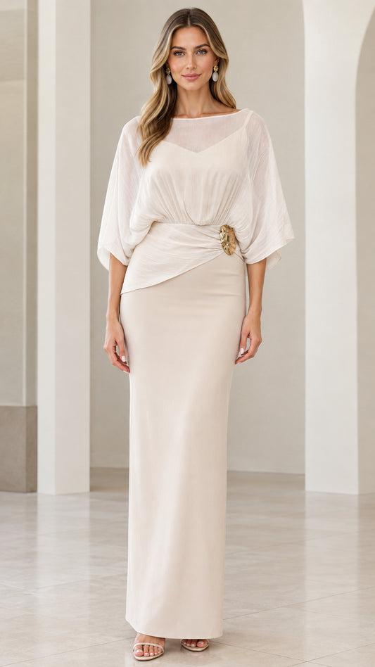 Full front view of elegant ivory chiffon capelet evening maxi dress with waist brooch