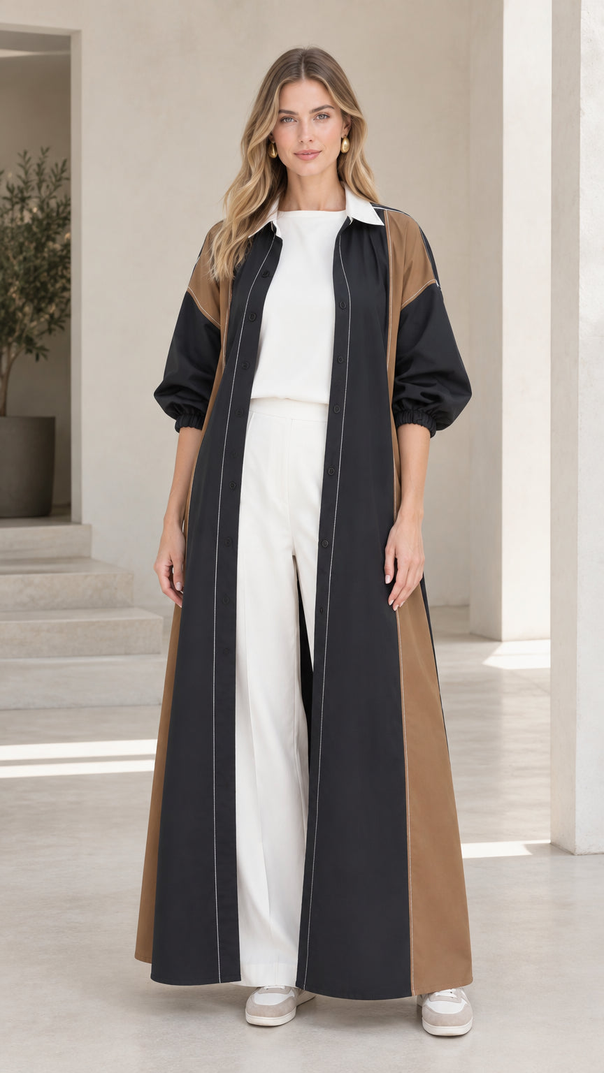 Model wearing Black colorblock maxi shirt dress duster layered over white outfit
