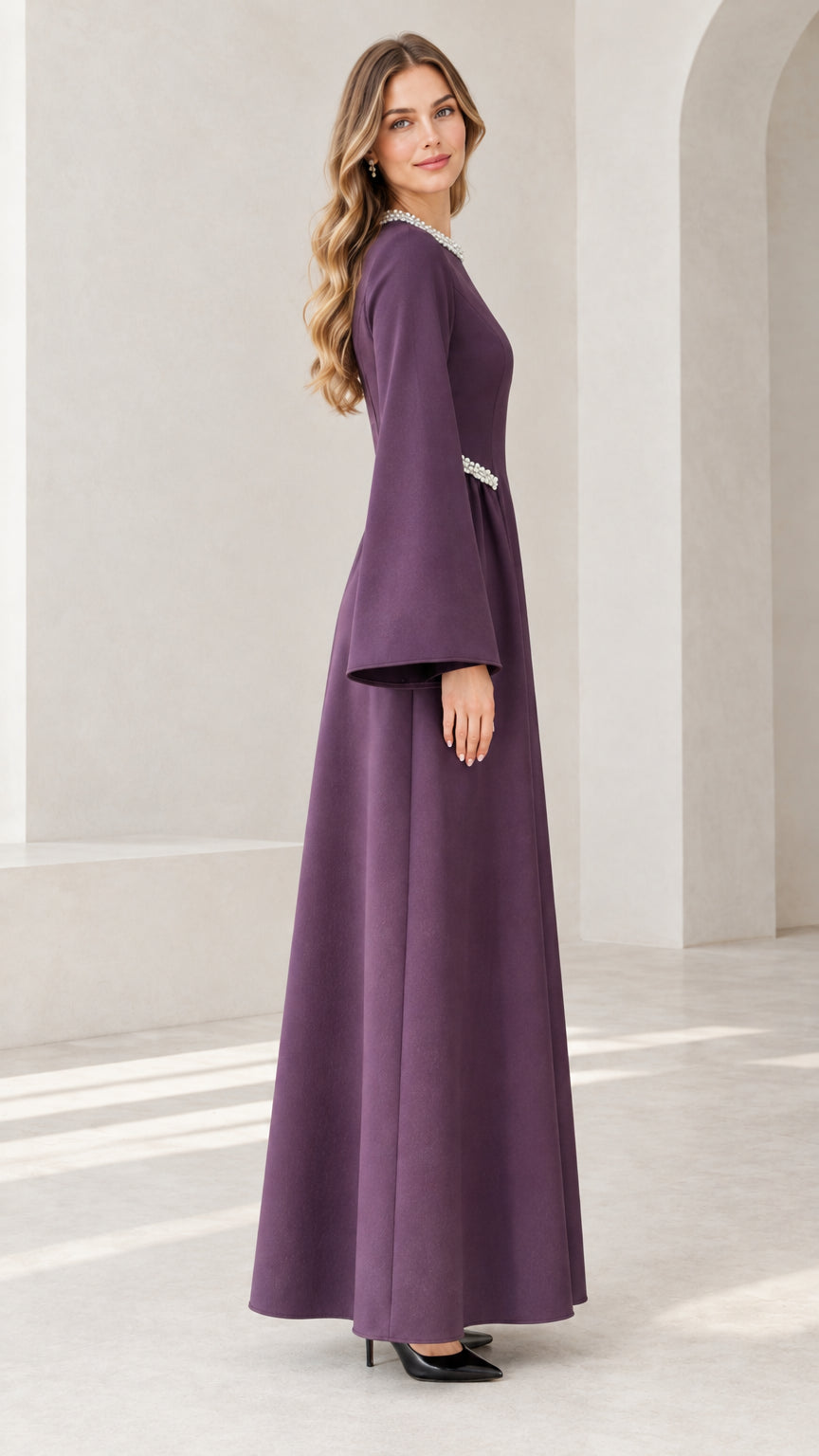 Side view of purple pearl-accented floor length maxi dress