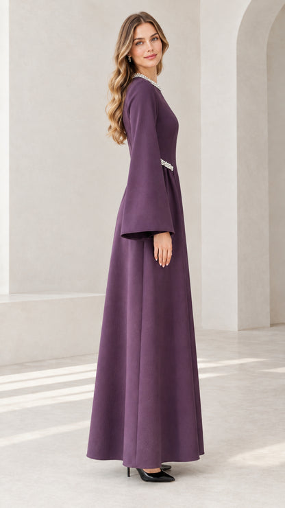 Side view of purple pearl-accented floor length maxi dress