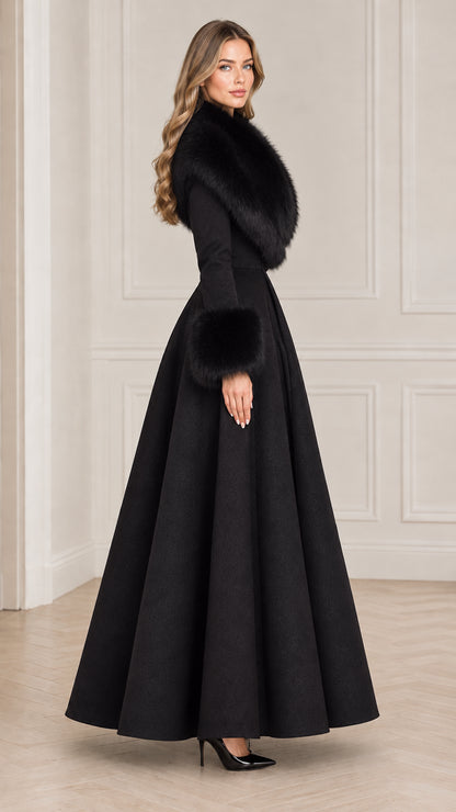 Side profile view of elegant black fit and flare maxi coat with fur trim
