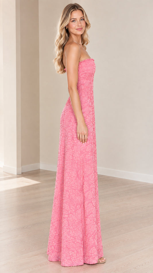 Side view of model wearing pink strapless floral textured maxi dress