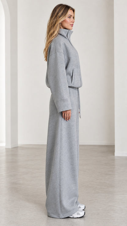 Side profile view of women's heather gray relaxed wide leg sweatpants set