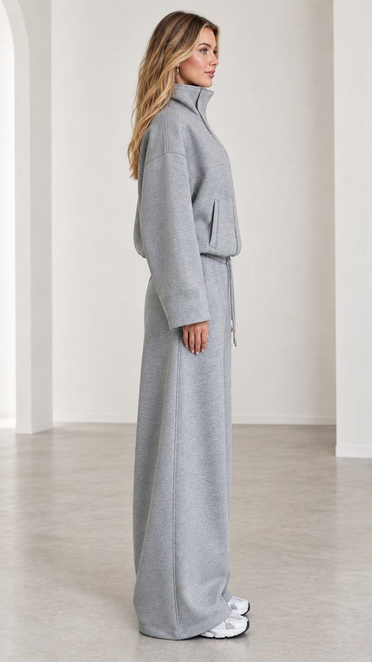 Side profile view of women's heather gray relaxed wide leg sweatpants set