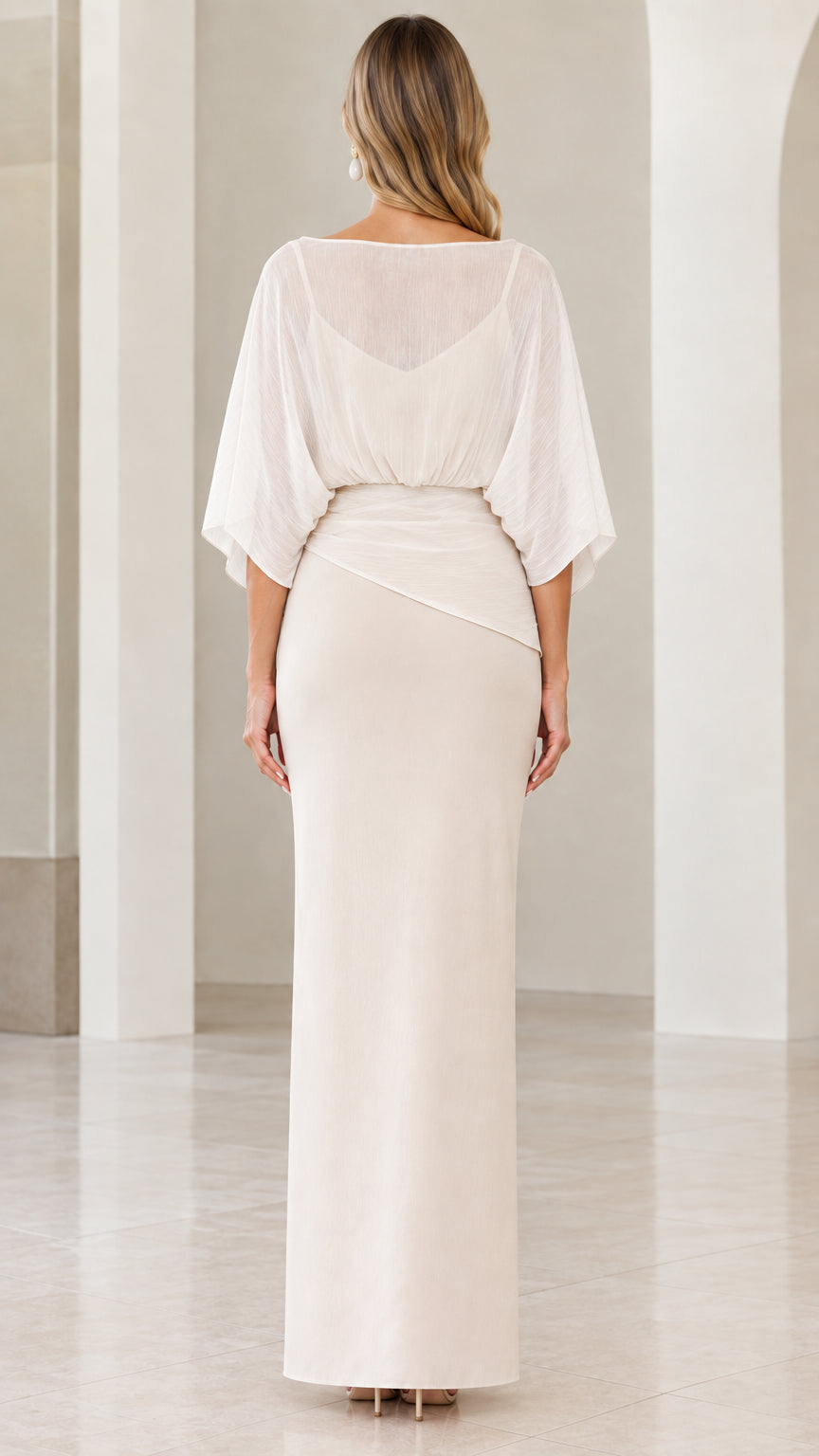 Back view of ivory floor-length evening dress with sheer draped cape