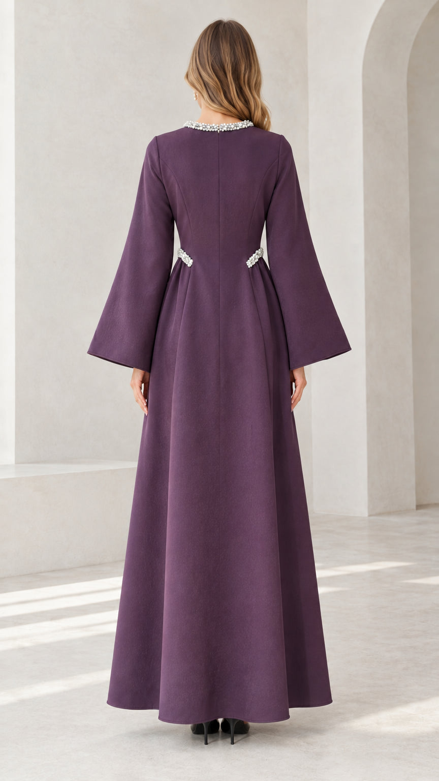 Back view of purple flare sleeve formal gown