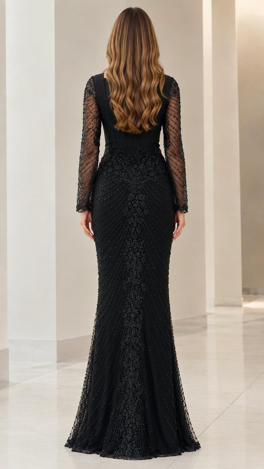 Back view of black floor-length formal dress with beaded skirt