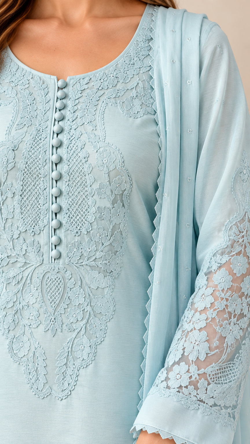 Close-up detail of sky blue bodice showing button placket and floral lace embroidery