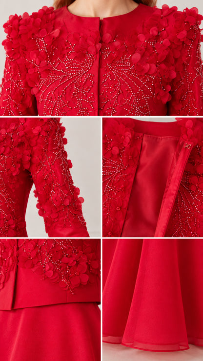 Close-up details of 3D floral petals, beading, zipper, and hem on red gown
