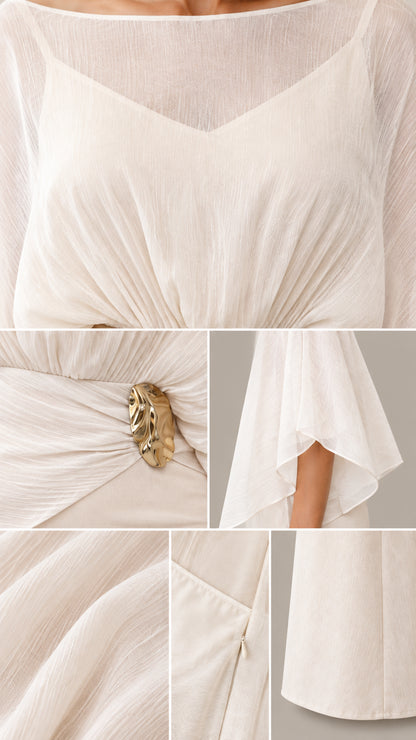 Close-up details of pleated chiffon bodice, metallic brooch, and sheer sleeves