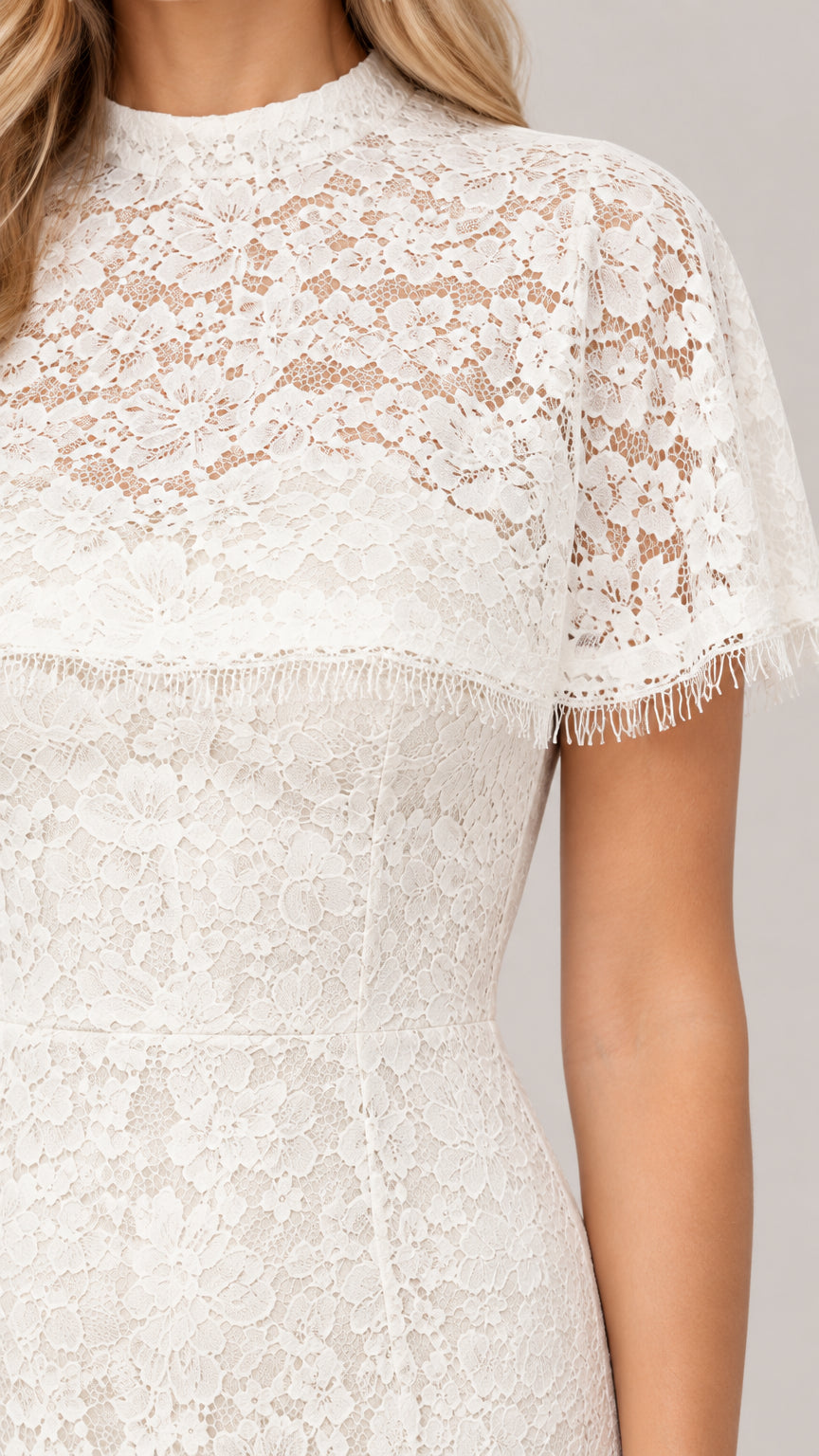 Close up of delicate ivory lace bodice, mock neckline, and eyelash trim detailing