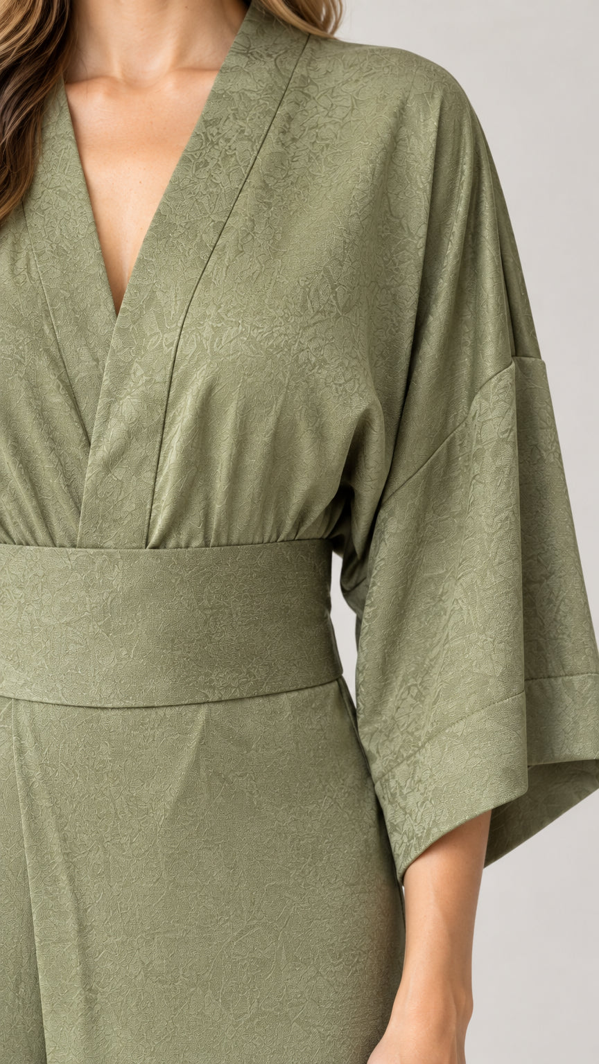 Close up texture detail of Sage Green kimono sleeve and crossover V-neckline
