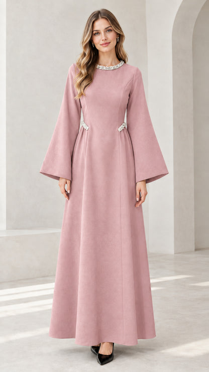 Front view of model wearing dusty pink embellished flare sleeve maxi dress