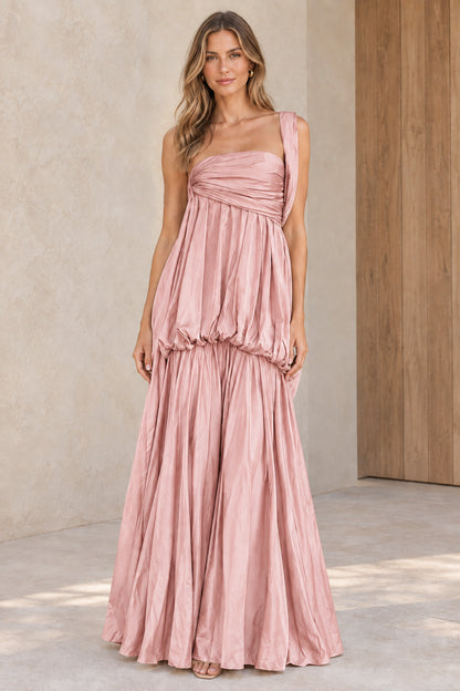 Front view of blush pink one-shoulder tiered pleated maxi formal gown
