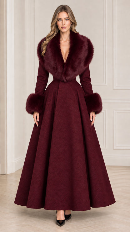 Model wearing rich burgundy wine red maxi coat with faux fur accents