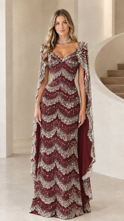 Front view of burgundy wine beaded scalloped evening gown with matching cape