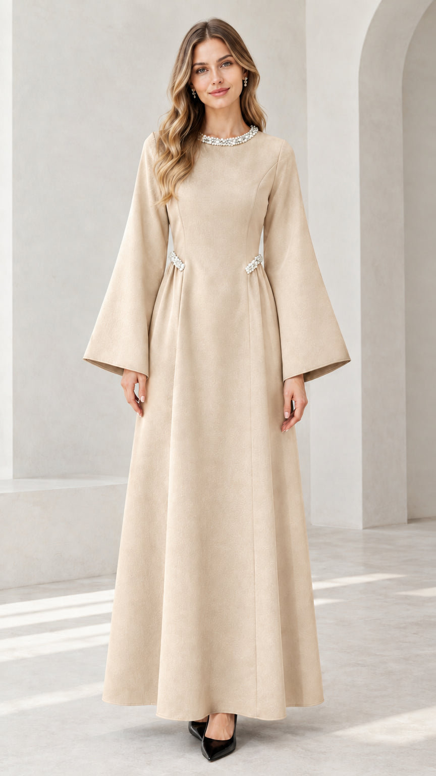 Front view of model wearing beige embellished flare sleeve maxi dress