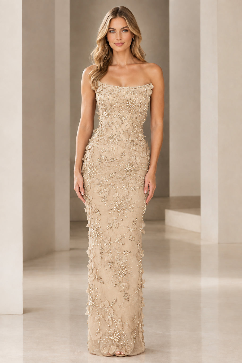Front view of strapless 3D floral beaded column gown in champagne